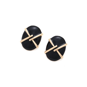 Detailed view of oval gold alloy earrings with black enamel geometric cross pattern