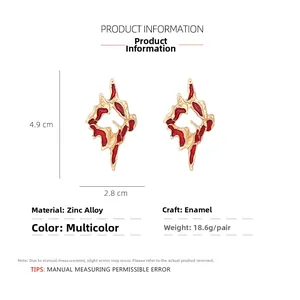 Detail view of red enamel irregular lava earrings with dimensions 4.9cm by 2.8cm