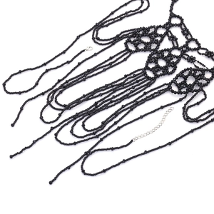 Detailed view of handmade multi-layer black beaded body chain with adjustable silver clasp
