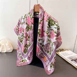 Detailed view of luxury floral silk scarf with vibrant purple and pink petals