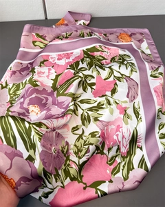 Detail of silk satin scarf featuring vintage floral print with purple and pink blossoms