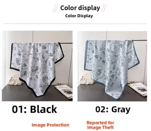 Detail display of ink flower silk scarves in black and grey elegant floral patterns