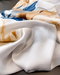 Close-up of elegant silk-satin scarf with marble pattern and pearly gloss texture