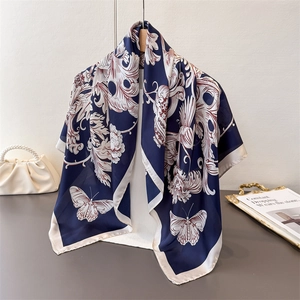 Elegant navy blue silk scarf with butterfly floral patterns and baroque scroll accents