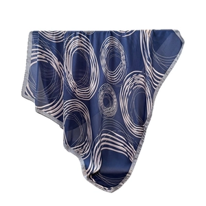 Dark blue silk scarf featuring white geometric abstract circle prints with fine rolled edges