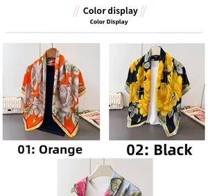 Detail of floral satin silk scarves in orange and black with elegant rose print