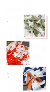 Close-up of elegant floral print satin scarf with fine rolled edge and silky texture