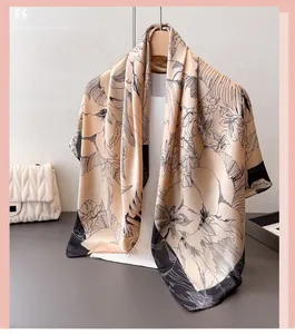 Detail of floral sketch print on satin scarf with smooth silk-like texture and sheen