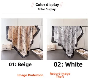 Detail view of beige and white floral satin scarves with artistic black line sketches
