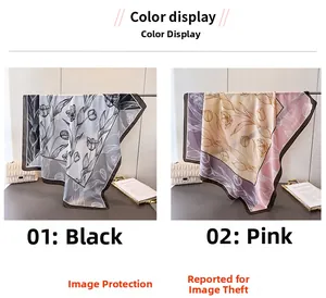 Dettaglio di foulard quadrati in raso nero e rosa con eleganti stampe floreali di tulipani