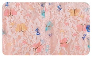 Detail of pink floral lace dress with colorful butterfly embroidery and hidden zipper