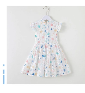 Detail of white lace girl dress with colorful butterfly prints and ruffled sleeves