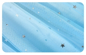 Detail of light blue mesh fabric with silver star and moon sequins for princess dress
