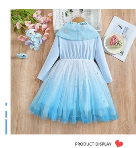 Detail of light blue Frozen style princess dress with snowflake collar and starry tulle