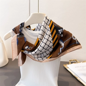 Vintage herringbone pattern silk-like scarf with geometric chain prints on mannequin