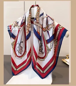 Close-up of vintage horse carriage pattern and retro buckle design on silk scarf