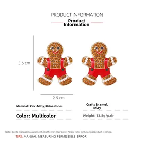 Detail view of rhinestone gingerbread man earrings with measurements 3.6cm x 2.9cm