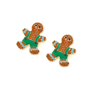 Sparkling rhinestone gingerbread man earrings with green enamel overalls on white background