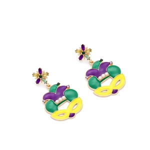 Detail of St. Patrick's Mardi Gras earrings with jester mask, enamel and pearls