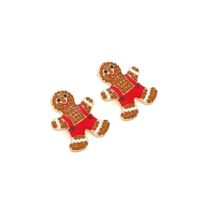Detail view of gingerbread man earrings with amber rhinestones and red enamel overalls