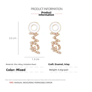 Detail view of OMG letter earrings with white enamel and pearls, 3.5cm size dimensions