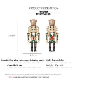 Detail of nutcracker earrings featuring colorful rhinestones and imitation pearls