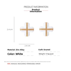 Detailed view of white enamel clover earrings with gold edges and dimensions 2.4cm