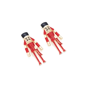 Nutcracker soldier earrings with red enamel and rhinestones on a white background