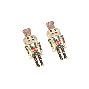 Detail of nutcracker soldier earrings with colorful rhinestones and red enamel finish