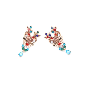 Close-up of Christmas reindeer earrings with colorful rhinestones and hanging gemstones