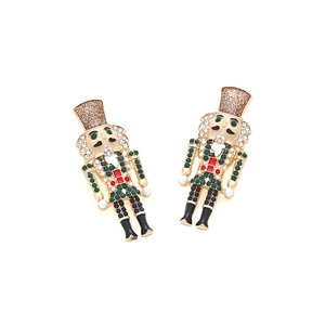 Detailed view of nutcracker earrings featuring colorful rhinestones and gold alloy base