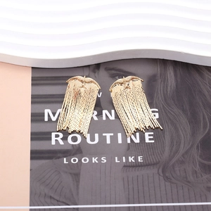 Vintage golden metal bird earrings with long tassel dangles in a stylish retro design