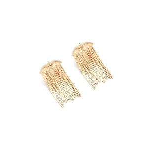 Close-up of gold bird tassel earrings with delicate long metal fringe hanging