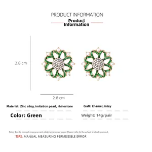 Detail of vintage flower stud earring with green enamel petals and crystal center