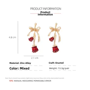 Detail view of red enamel rose earrings with gold bow showing dimensions 4.8cm by 2.1cm