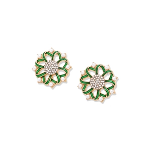 Macro shot of vintage floral stud earrings with green enamel and crystal center