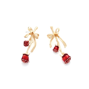 Elegant gold bow earrings with red enamel rose petals in a vintage drop style