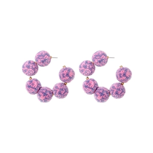 Bohemian C-shaped gold hoop earrings with purple and pink handmade fuzzy pom-poms