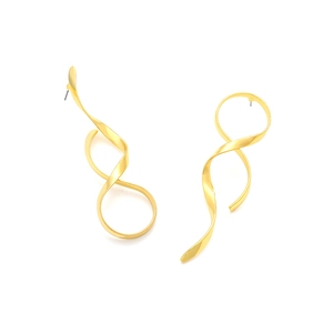 Macro view of abstract gold twisted spiral earrings with sleek metallic finish