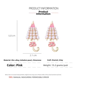 Detailed view of pink umbrella earrings with pearls and dimensions 5.0cm x 2.1cm