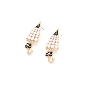 Detail of umbrella earrings with faux pearls, black enamel bow and sparkling crystal