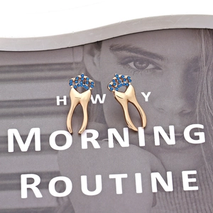Fashionable golden crown tooth stud earrings with sparkling blue rhinestones
