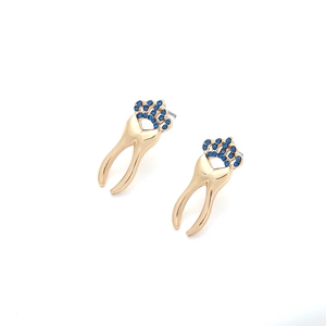 Unique gold molar tooth stud earrings featuring blue rhinestone crowns on a white background