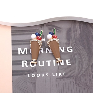 Close-up of alloy ice cream cup earrings with brown enamel and sparkling rhinestones