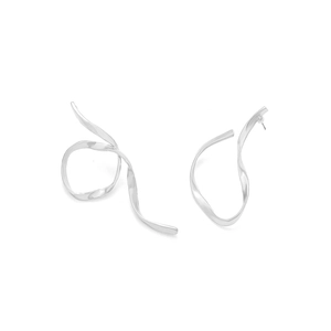 Detailed close-up of asymmetrical twisted silver earrings with a matte metallic texture