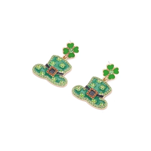 Detail of St. Patrick's Day green hat earrings with four-leaf clover and rhinestones