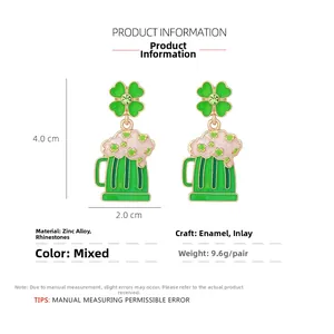 Detail of St. Patrick's Day green beer mug earrings with enamel clover and green rhinestones