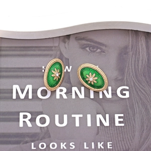 Vintage oval gold-tone flower studs with emerald green enamel and center crystals