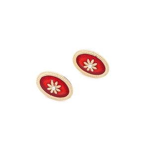 Macro shot of oval vintage court earrings with red enamel and gold flower detail