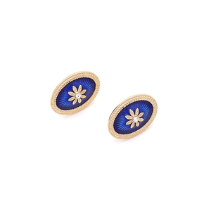 Close-up of vintage oval enamel earrings with gold flower and crystal inlay detail
